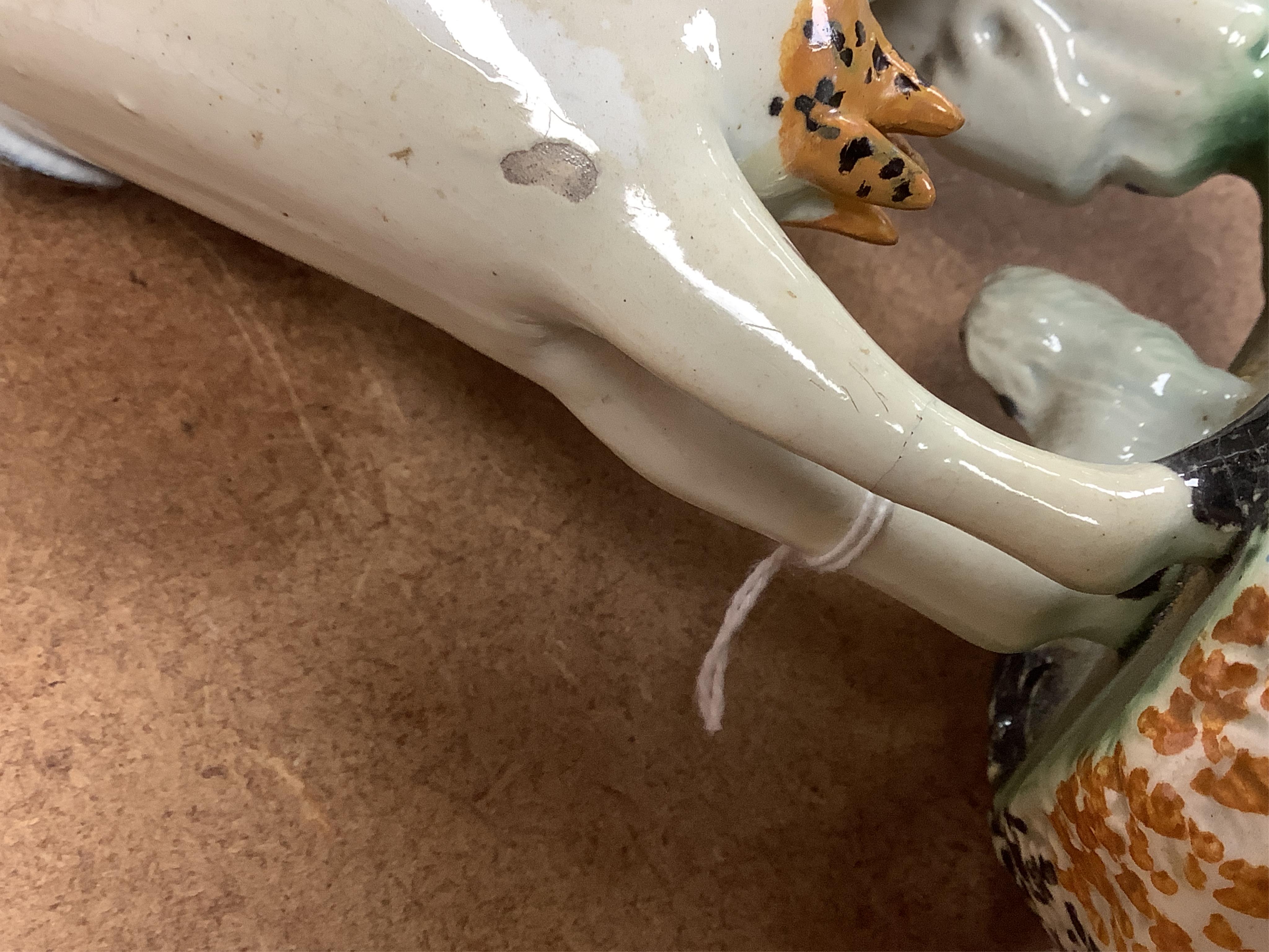 Two Yorkshire Prattware cows, with farmer or milkmaid and dog groups, c.1810